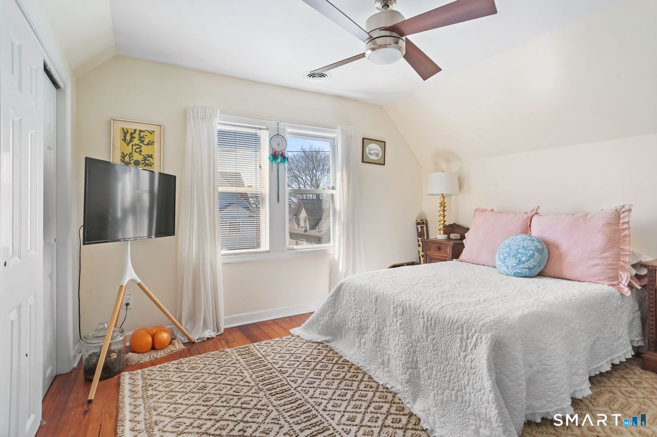 148 Alfred Street Bridgeport, CT 06605 - Photo 53 of 53 a bedroom with a bed and wooden floor
