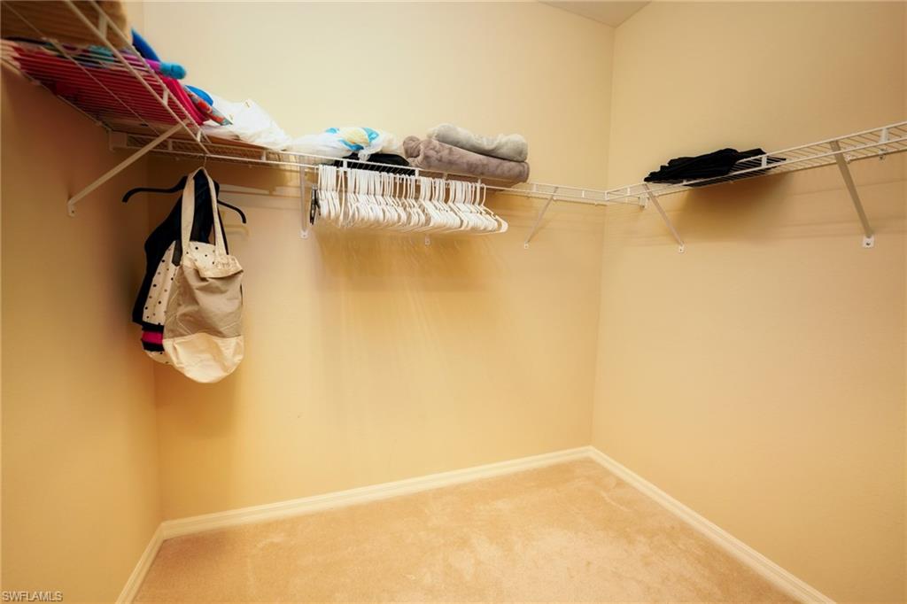 9054 Capistrano Street North, Unit 4002 Naples, FL 34113 - Photo 20 of 26 a view of walk in closet with empty space