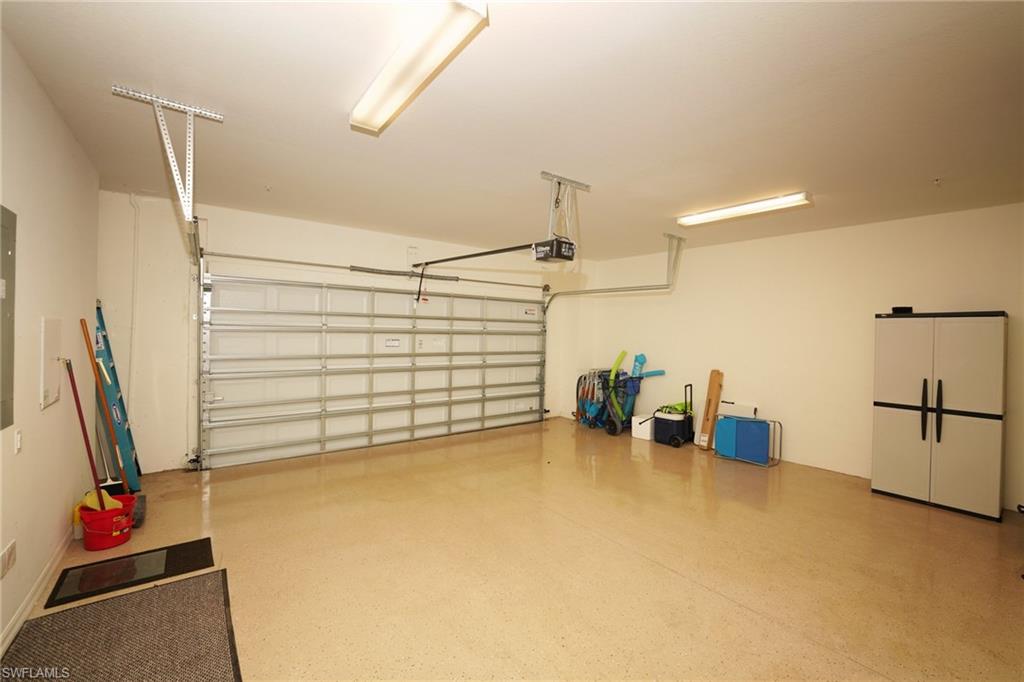 9054 Capistrano Street North, Unit 4002 Naples, FL 34113 - Photo 25 of 26 a view of a storage & utility room with two washing machine