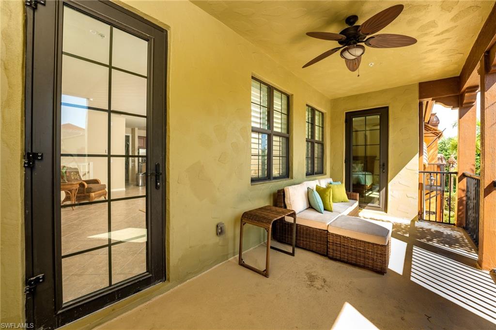 9054 Capistrano Street North, Unit 4002 Naples, FL 34113 - Photo 3 of 26 a living room with furniture and a window