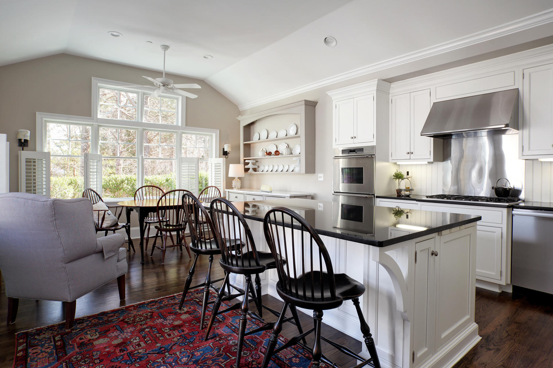 199 East Bay Road, Unit 12 Osterville, MA 02655 - Photo 11 of 40 a kitchen with stainless steel appliances granite countertop a stove a sink a dining table and chairs