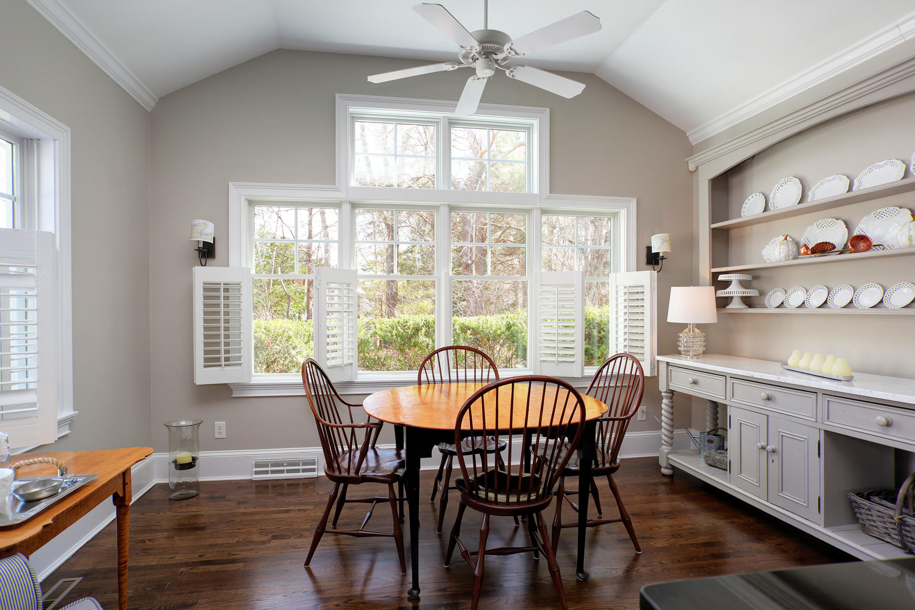 199 East Bay Road, Unit 12 Osterville, MA 02655 - Photo 12 of 40 a dining room with furniture a chandelier and wooden floor