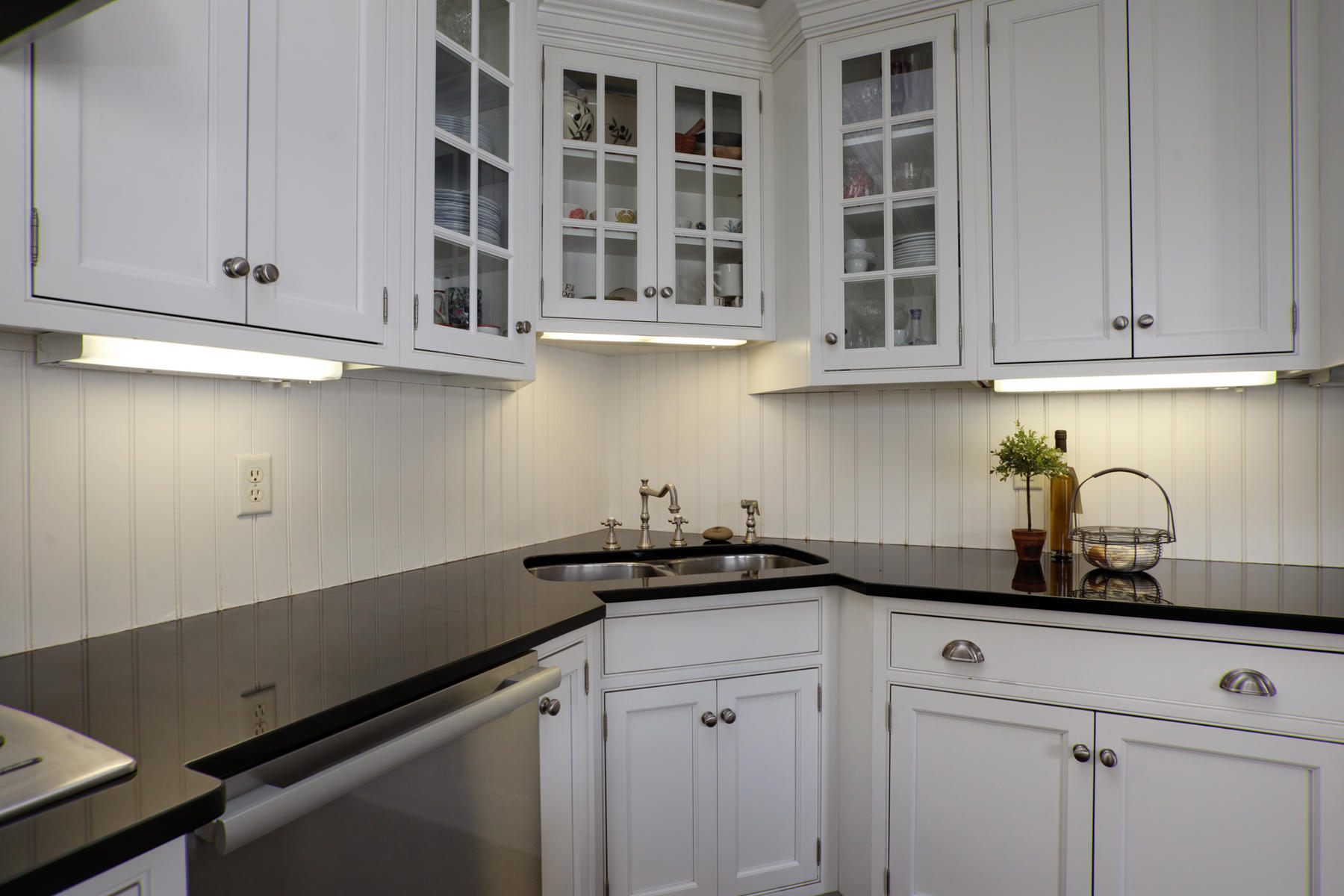 199 East Bay Road, Unit 12 Osterville, MA 02655 - Photo 14 of 40 a kitchen with a sink cabinets and stainless steel appliances