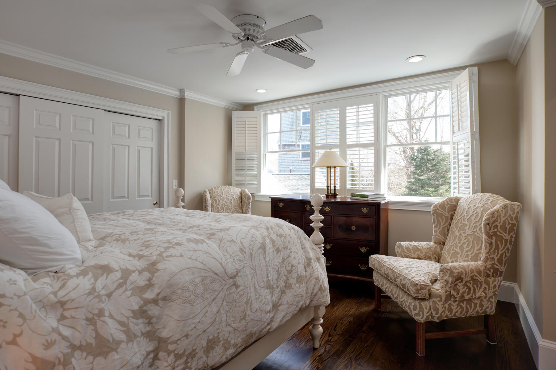 199 East Bay Road, Unit 12 Osterville, MA 02655 - Photo 27 of 40 a bedroom with a bed and wooden floor