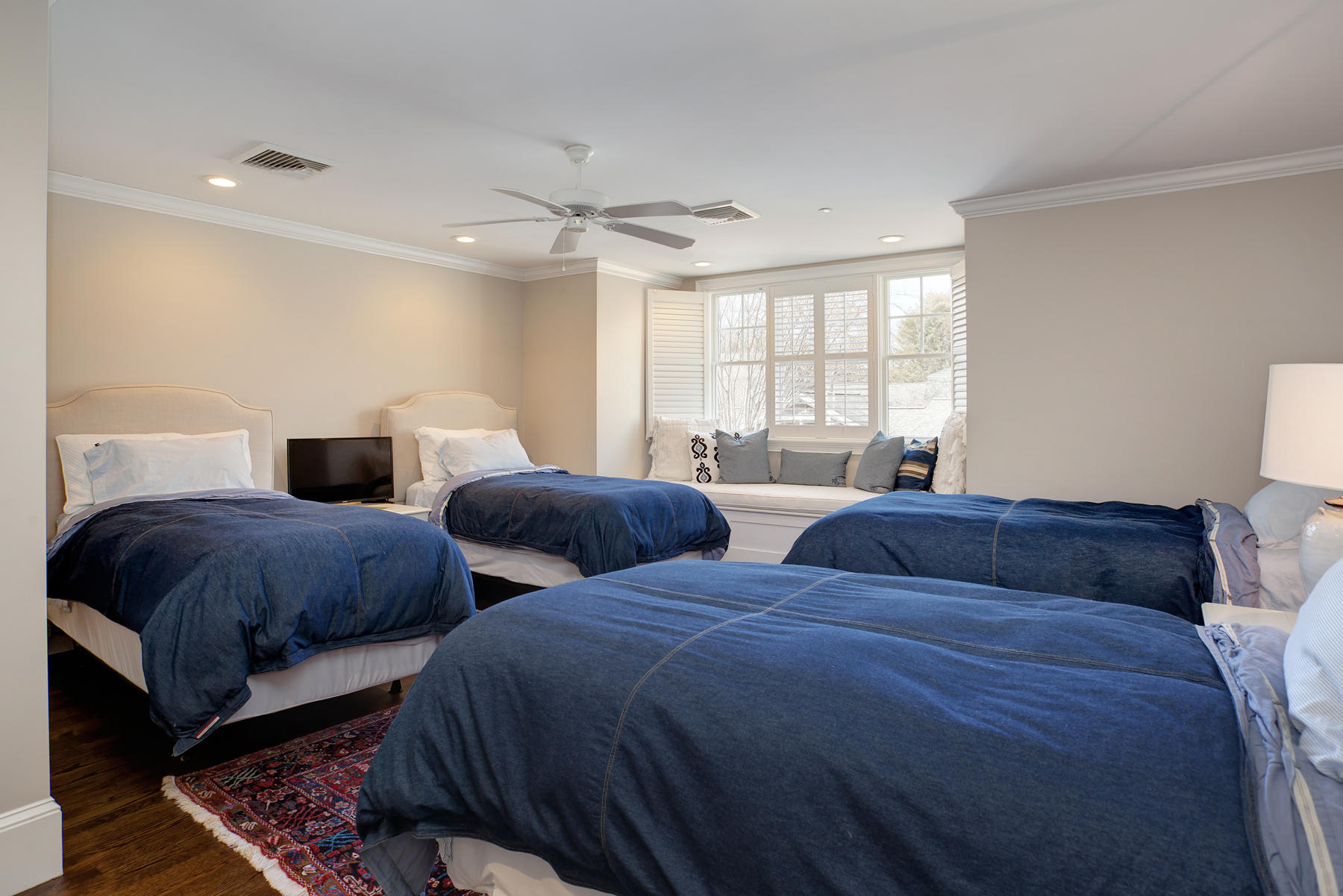 199 East Bay Road, Unit 12 Osterville, MA 02655 - Photo 30 of 40 a bedroom with two beds and a chandelier