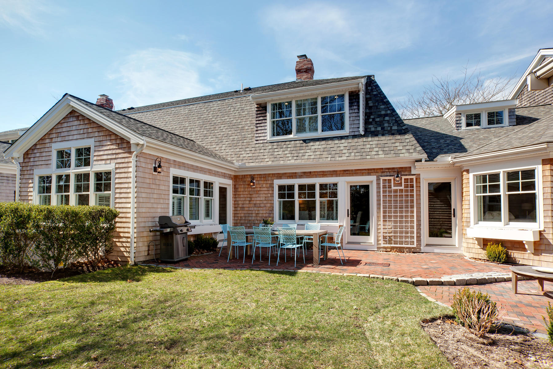 199 East Bay Road, Unit 12 Osterville, MA 02655 - Photo 32 of 40 a front view of a house with a yard