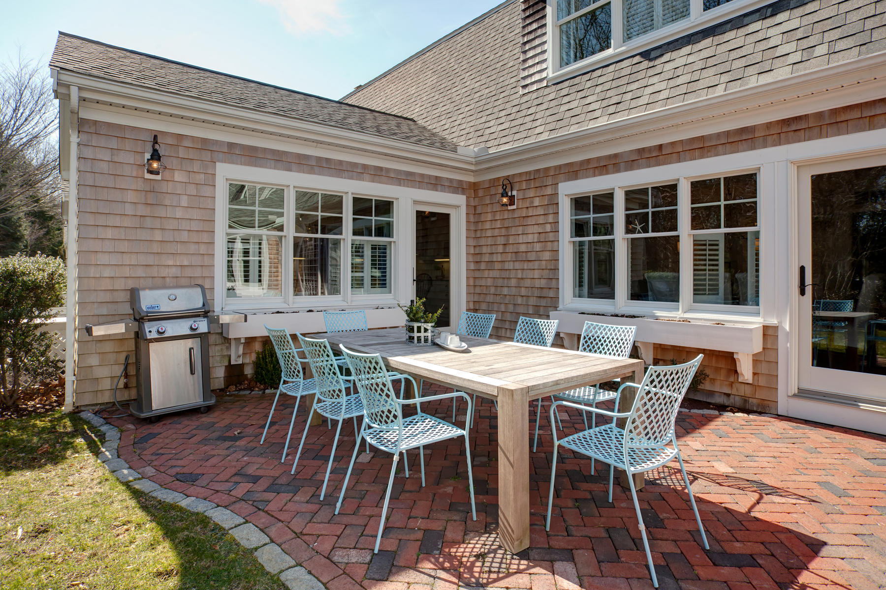 199 East Bay Road, Unit 12 Osterville, MA 02655 - Photo 33 of 40 a view of a house with a backyard and sitting area