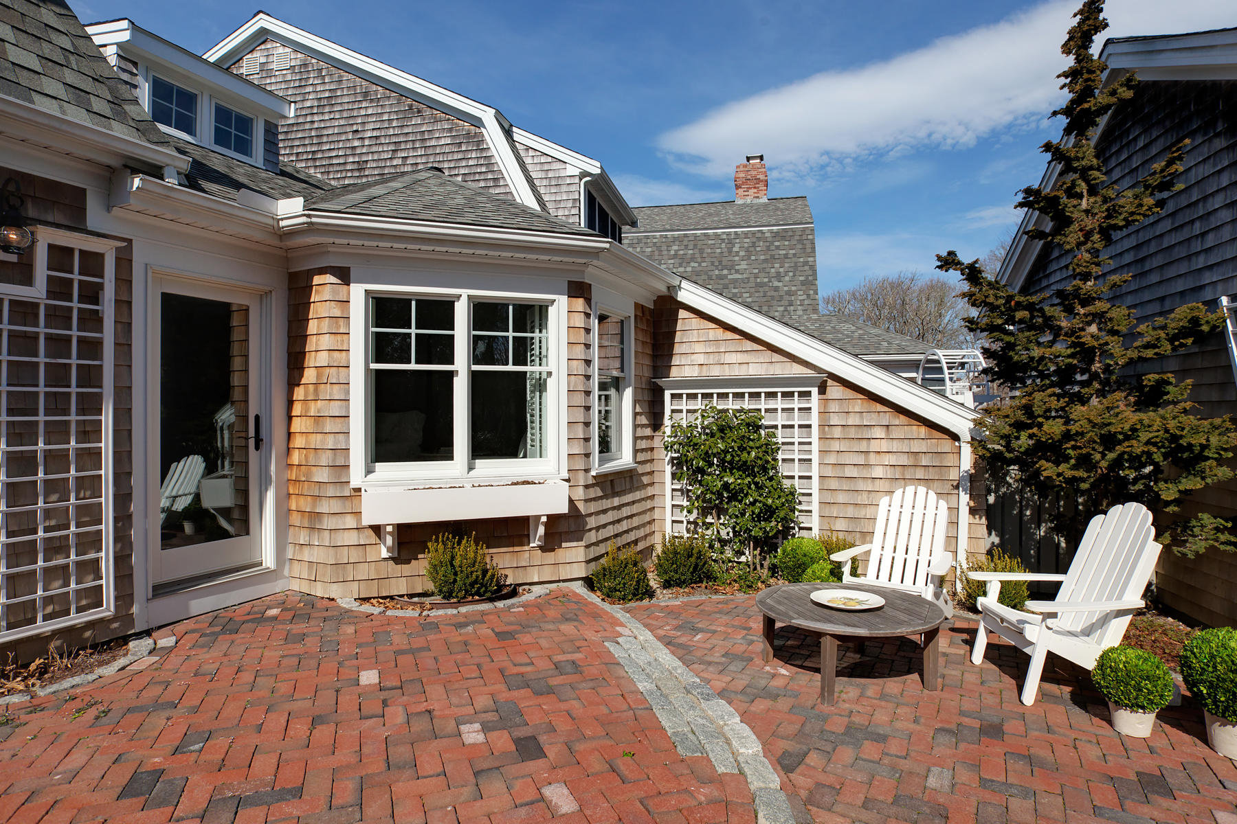 199 East Bay Road, Unit 12 Osterville, MA 02655 - Photo 34 of 40 a front view of a house with sitting area