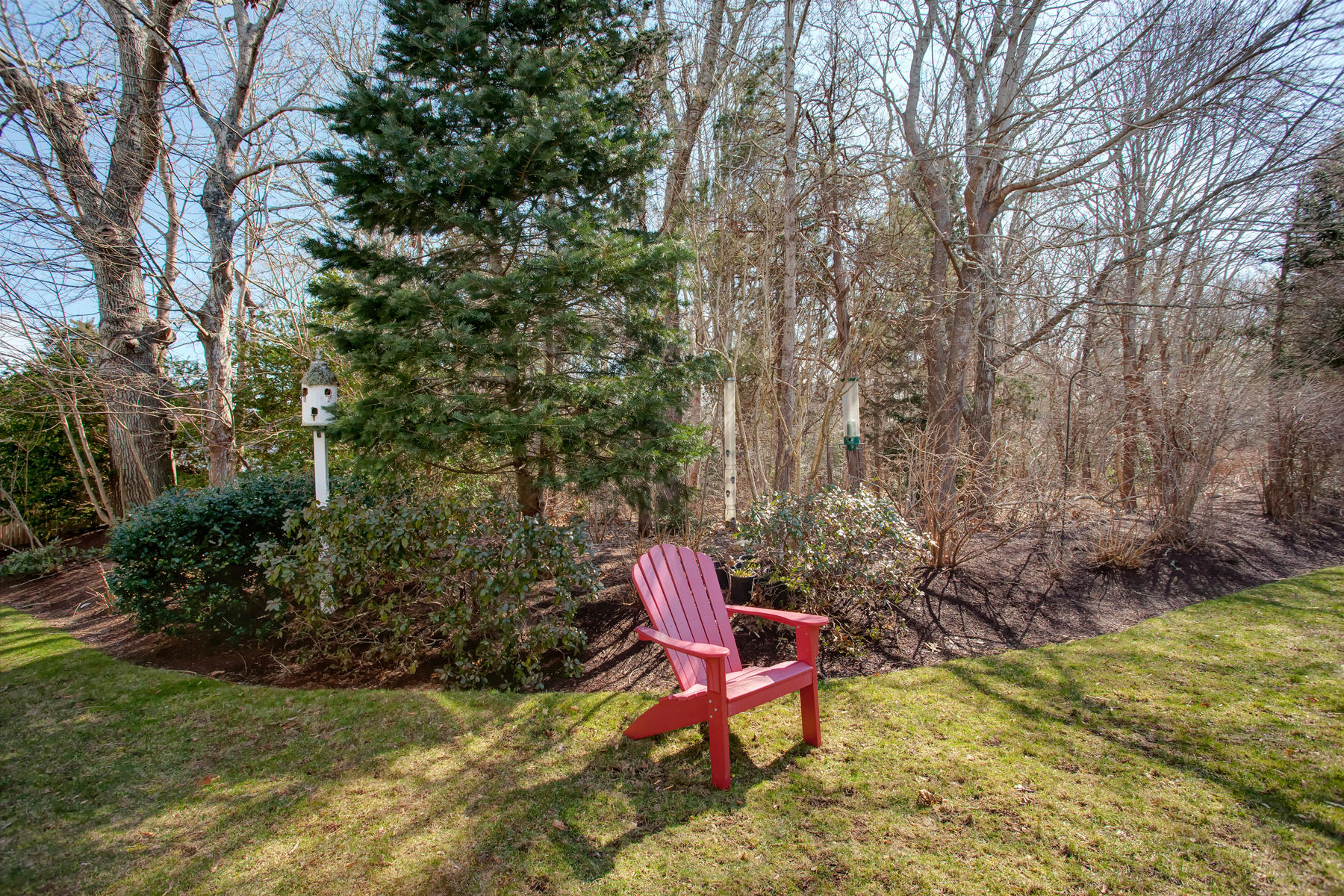 199 East Bay Road, Unit 12 Osterville, MA 02655 - Photo 36 of 40 a chair and table in the garden