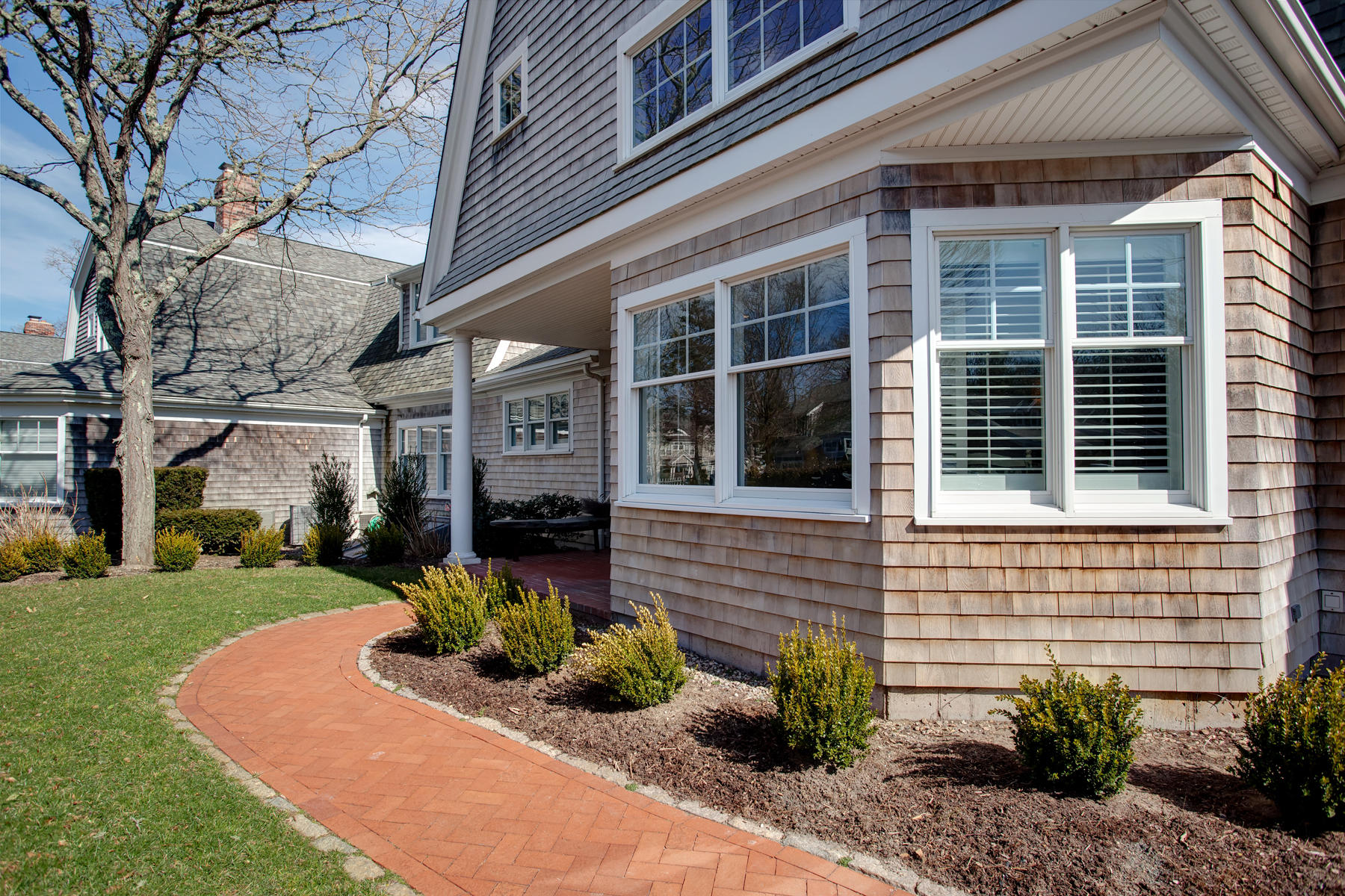 199 East Bay Road, Unit 12 Osterville, MA 02655 - Photo 38 of 40 a front view of a house with garden and plants