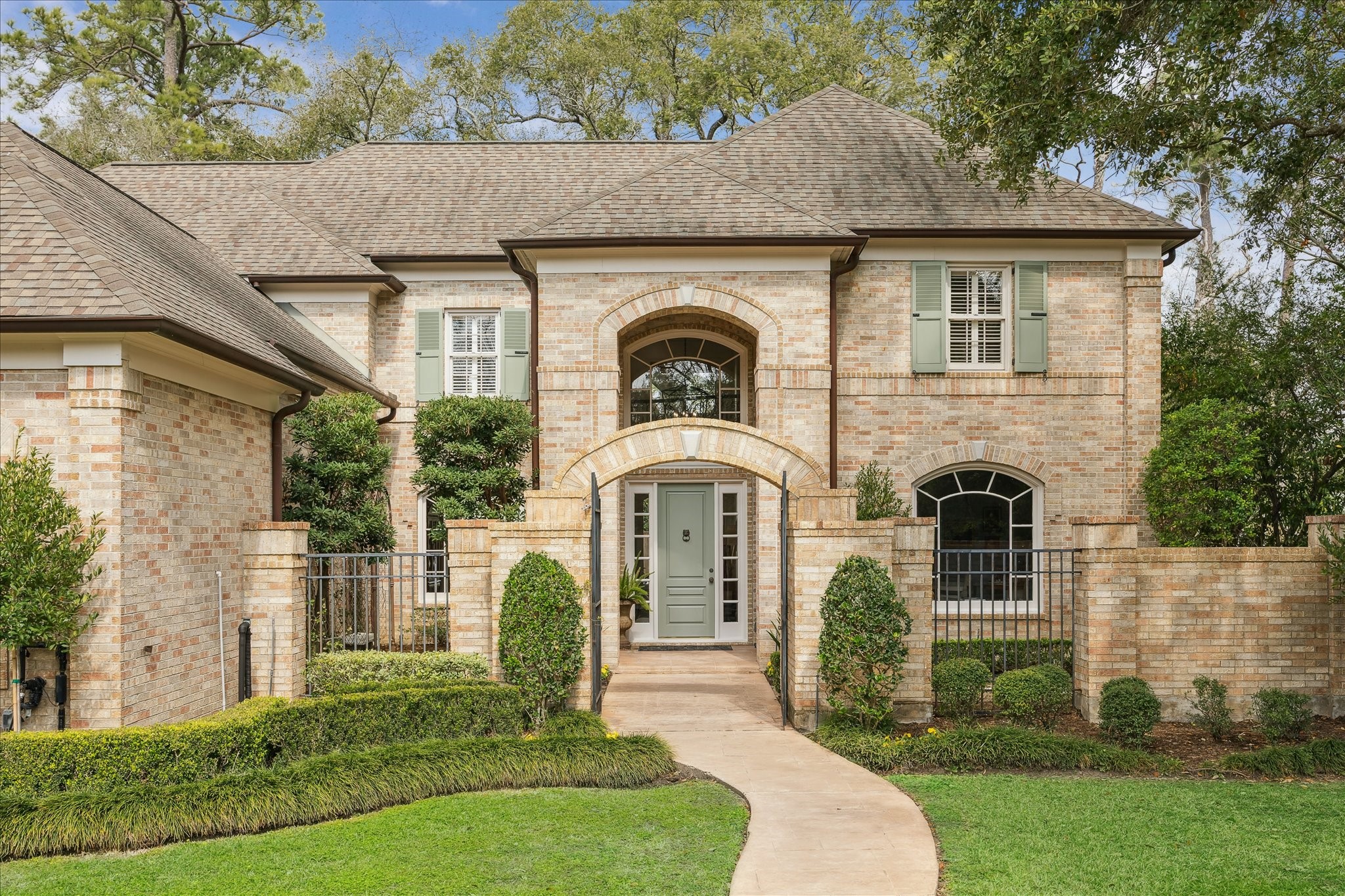 Stately five-bedroom custom home built in 1997 by Jim Frankel, set on an almost half-acre lot in Hedwig Village. A charming gated courtyard entry welcomes you to the home. Architectural details include copper gutters and Timberlane custom working shutters with shutter dogs. Zoned to Memorial Drive Elementary, Spring Branch Middle School, and Memorial High School.