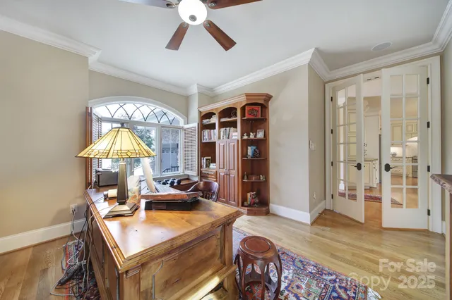 a spacious bathroom with a tub sink and mirror