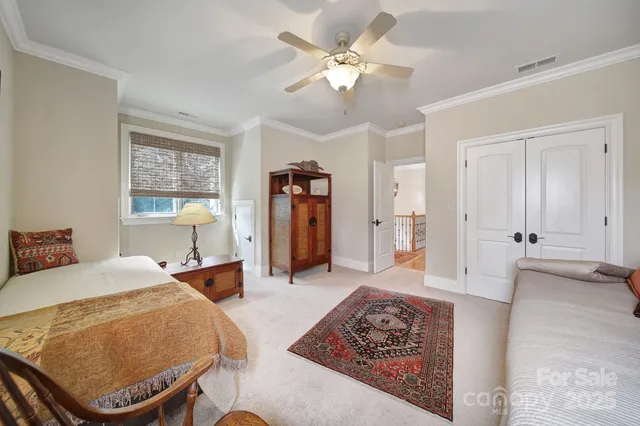 a front view of a house with yard and green space