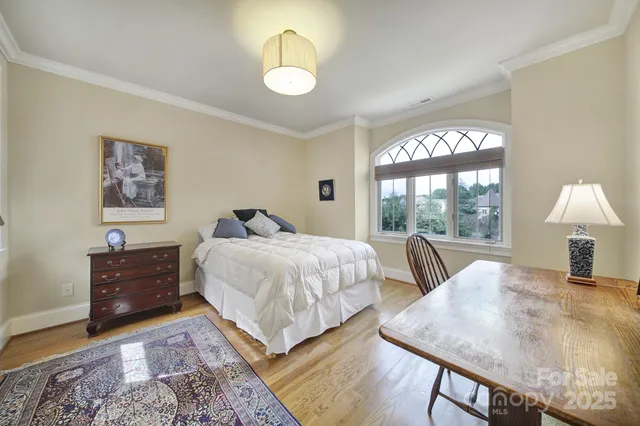 a view of a patio with chairs and potted plants