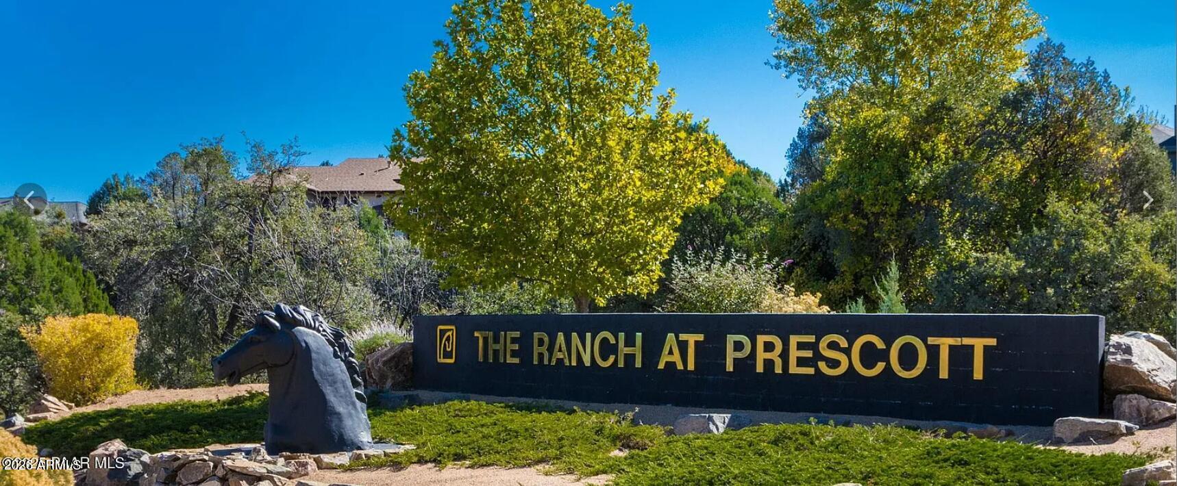 2808 Mystic Bend, Unit 676 Prescott, AZ 86303 - Photo 3 of 3 a view of a wooden fence and a bench