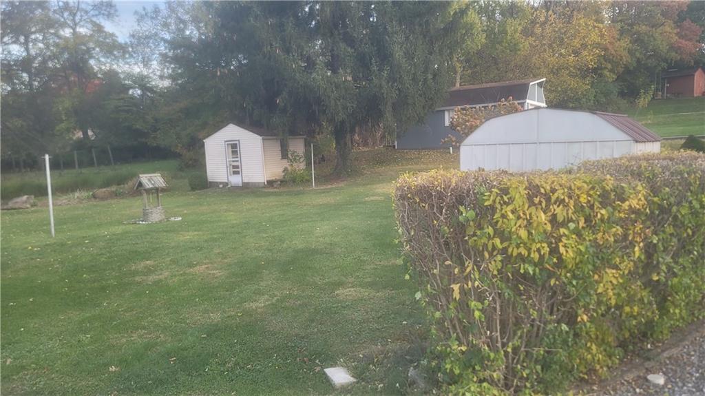 48 Ewing Road McKees Rocks, PA 15136 - Photo 6 of 6 a backyard of a house with table and chairs