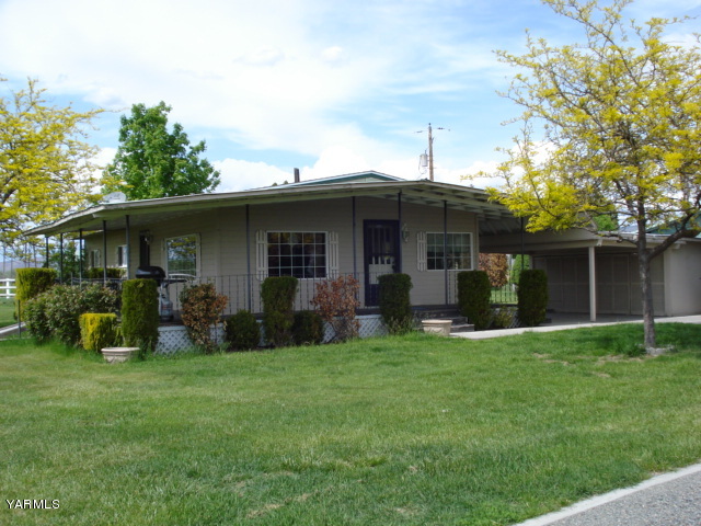 2512 Birchfield Road Yakima, WA 98901 - Photo 2 of 20 a front view of house with yard and green space