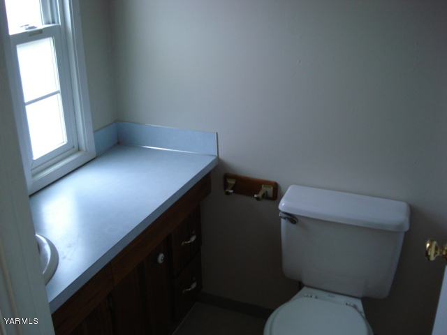 2512 Birchfield Road Yakima, WA 98901 - Photo 9 of 20 a bathroom with a toilet sink and window
