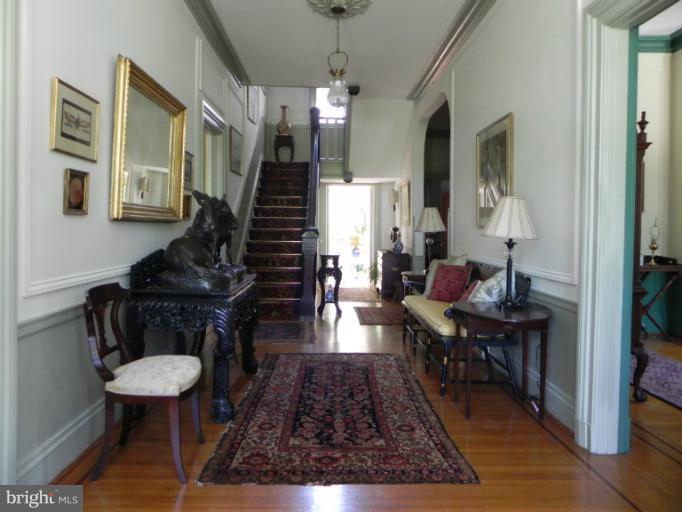 1705 South Road Baltimore, MD 21209 - Photo 2 of 29 a living room with furniture and wooden floor