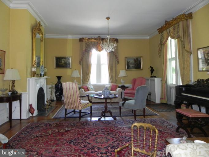 1705 South Road Baltimore, MD 21209 - Photo 11 of 29 a living room with furniture and a chandelier