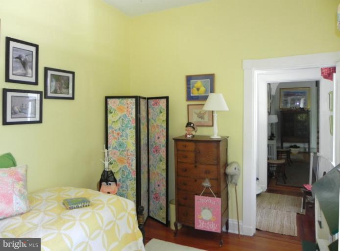 1705 South Road Baltimore, MD 21209 - Photo 13 of 29 a bedroom with a bed and a mirror