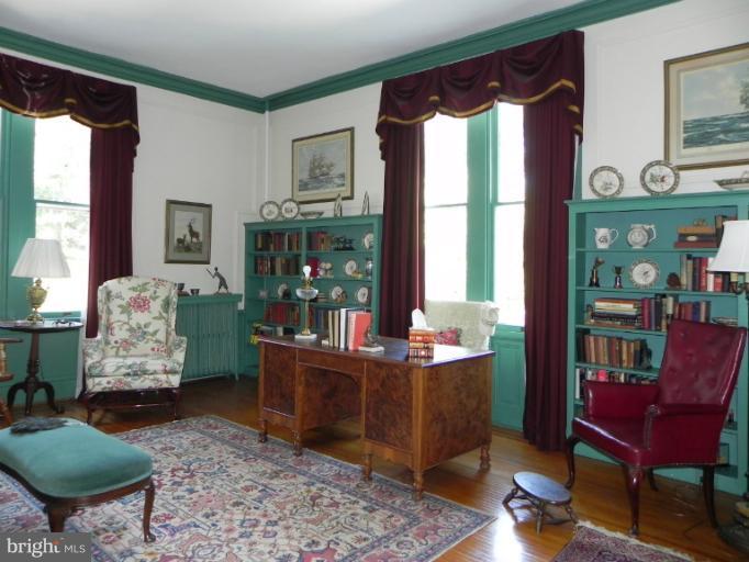 1705 South Road Baltimore, MD 21209 - Photo 3 of 29 a living room with furniture and a floor to ceiling window