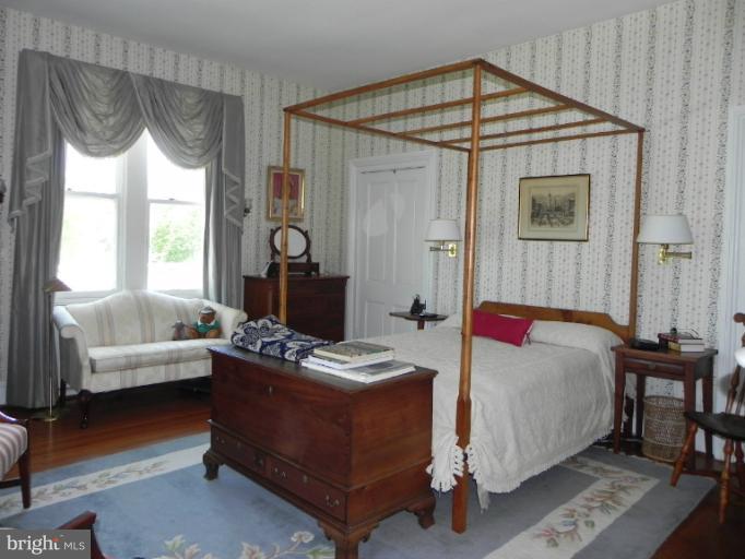 1705 South Road Baltimore, MD 21209 - Photo 22 of 29 a bedroom with a bed and a window