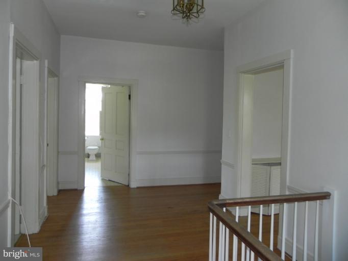 1705 South Road Baltimore, MD 21209 - Photo 23 of 29 a view of a hallway with wooden floor