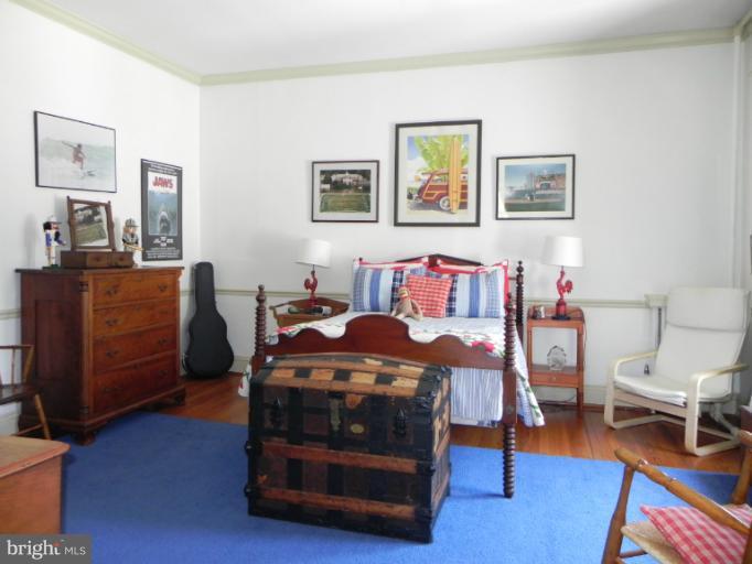 1705 South Road Baltimore, MD 21209 - Photo 25 of 29 a bedroom with a bed and furniture