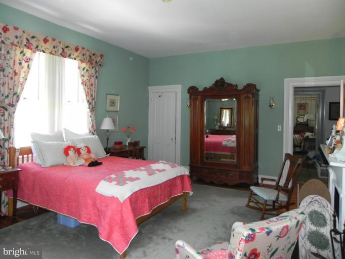 1705 South Road Baltimore, MD 21209 - Photo 26 of 29 a bedroom with a bed dresser and a window