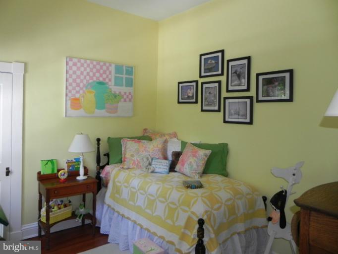 1705 South Road Baltimore, MD 21209 - Photo 5 of 29 a bedroom with a bed and painting on the wall
