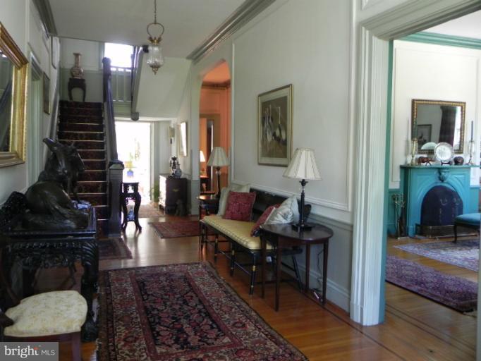 1705 South Road Baltimore, MD 21209 - Photo 8 of 29 a view of a hallway with a livingroom and furniture
