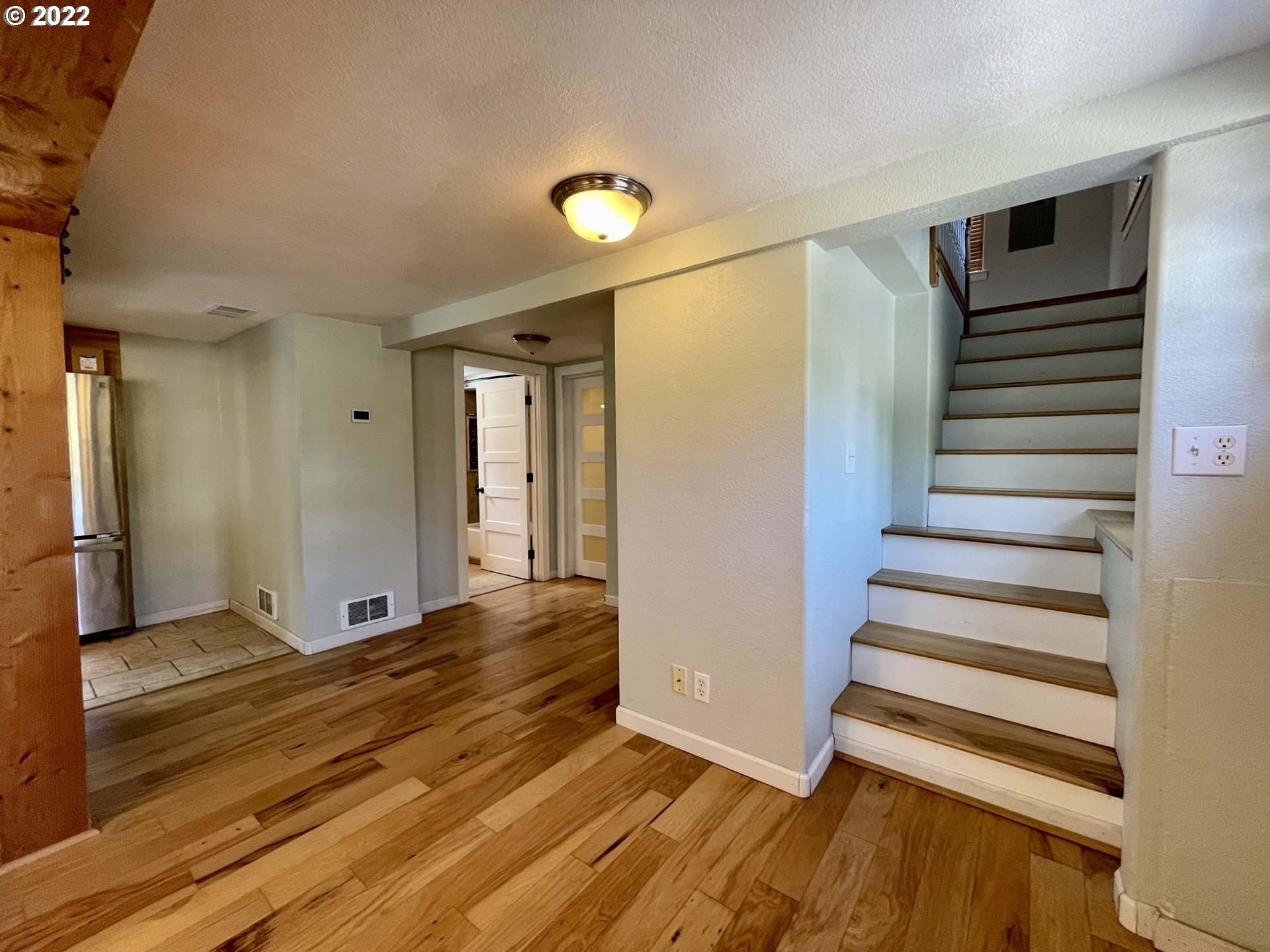 2275 Oak Street North Bend, OR 97459 - Photo 14 of 30 a view of entryway with wooden floor and stairs