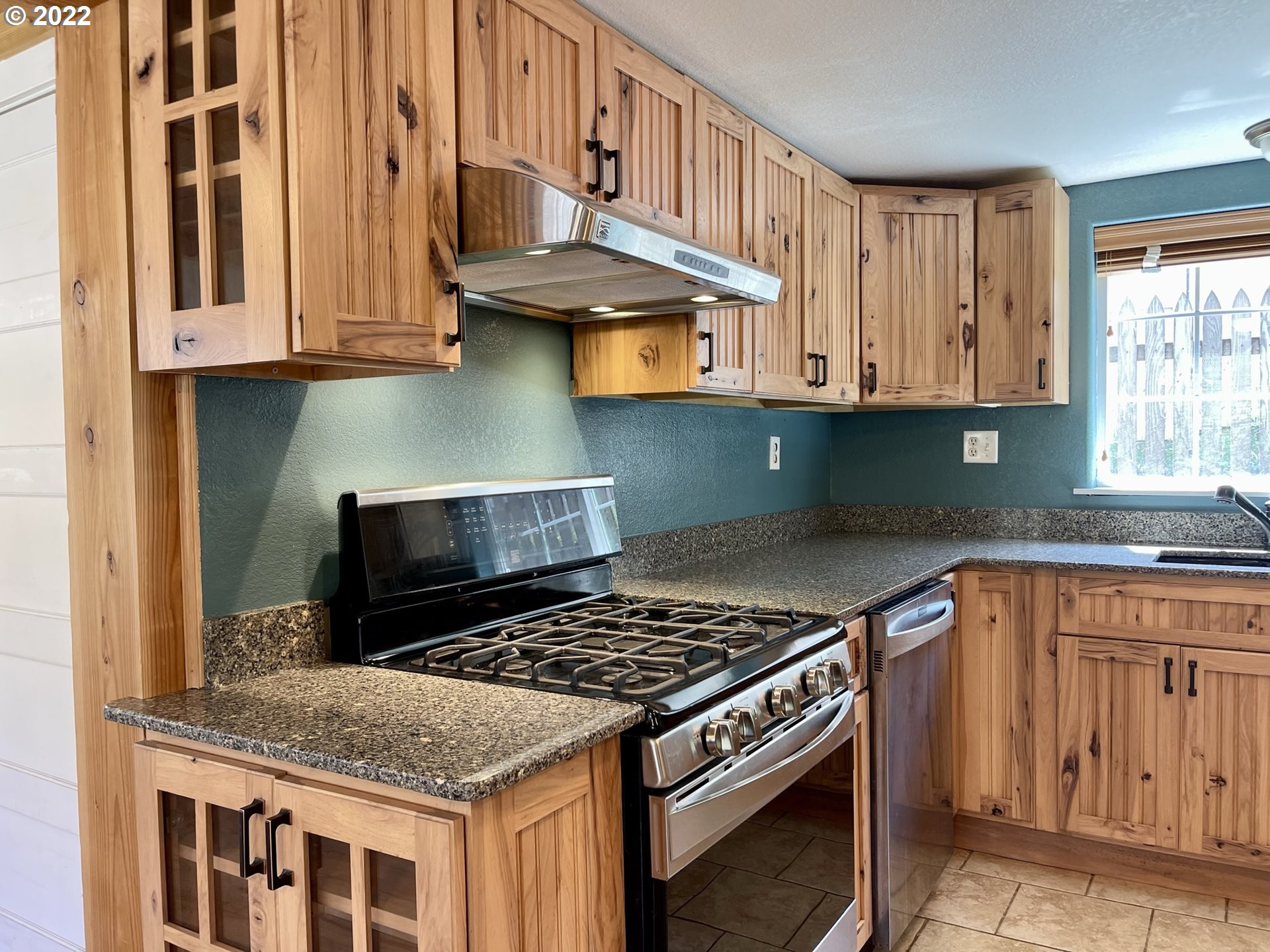 2275 Oak Street North Bend, OR 97459 - Photo 18 of 30 a kitchen with stainless steel appliances granite countertop a stove and a sink
