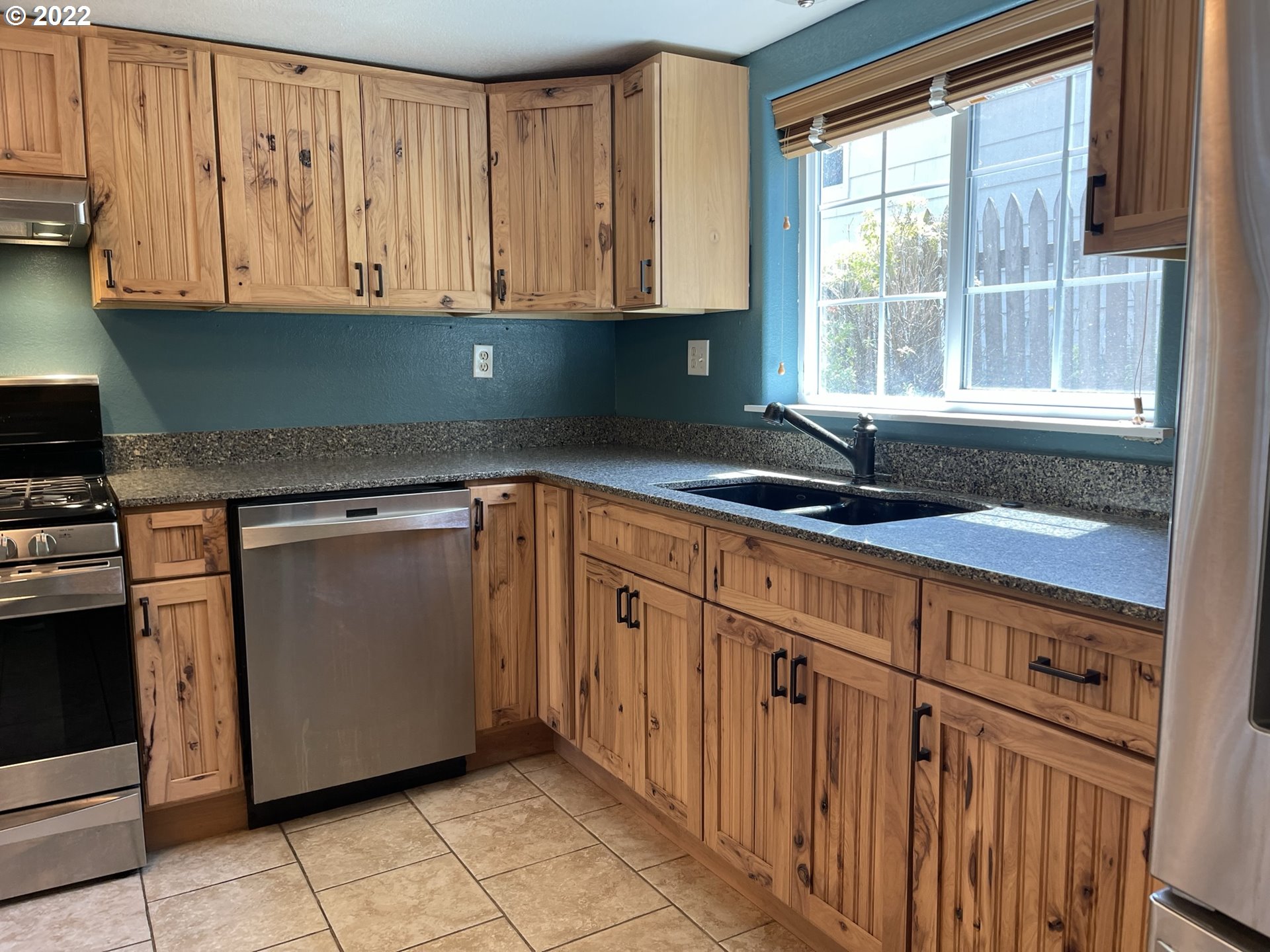 2275 Oak Street North Bend, OR 97459 - Photo 19 of 30 a kitchen with granite countertop cabinets sink and window