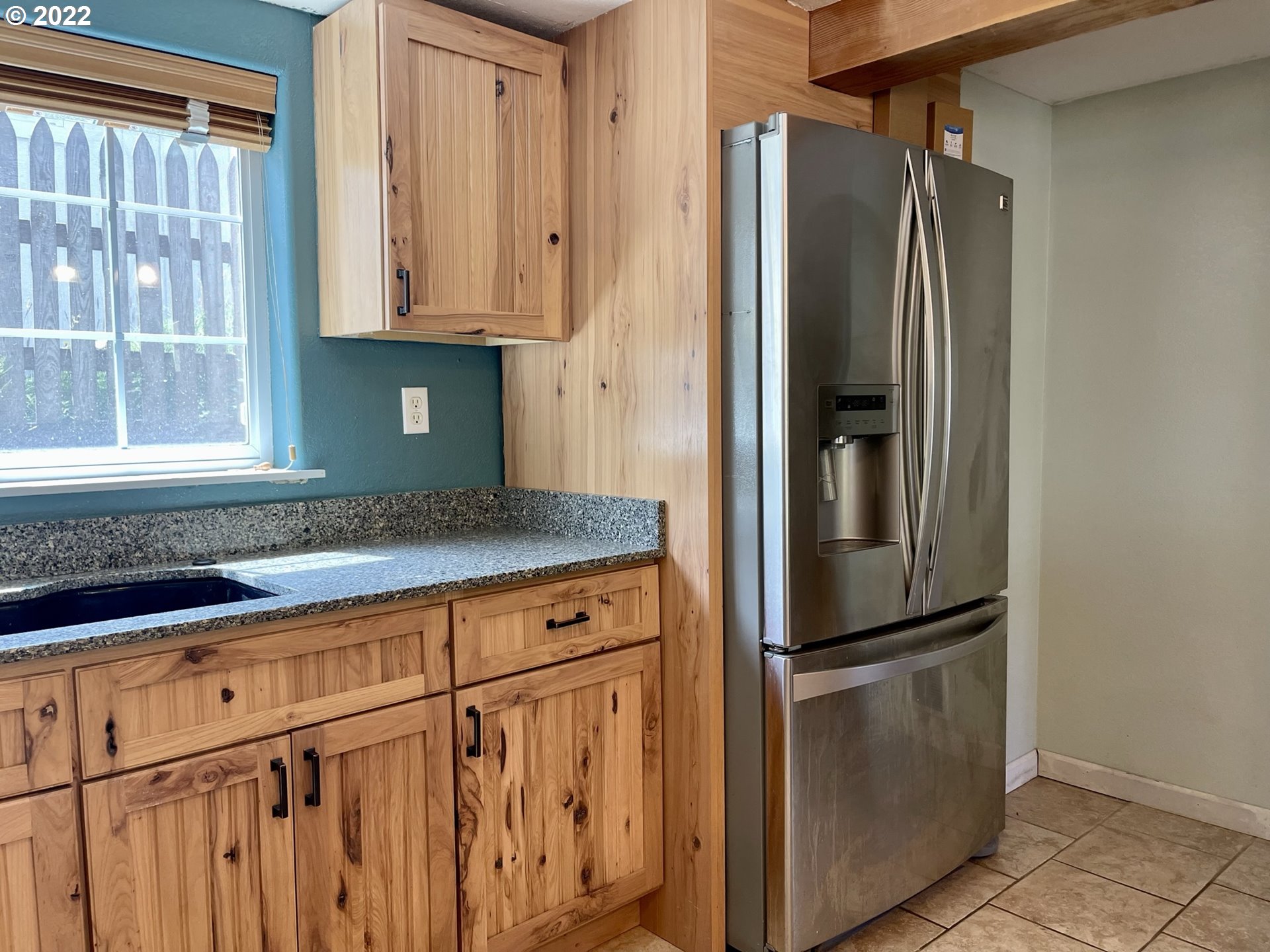 2275 Oak Street North Bend, OR 97459 - Photo 20 of 30 a kitchen with stainless steel appliances granite countertop a refrigerator and a sink