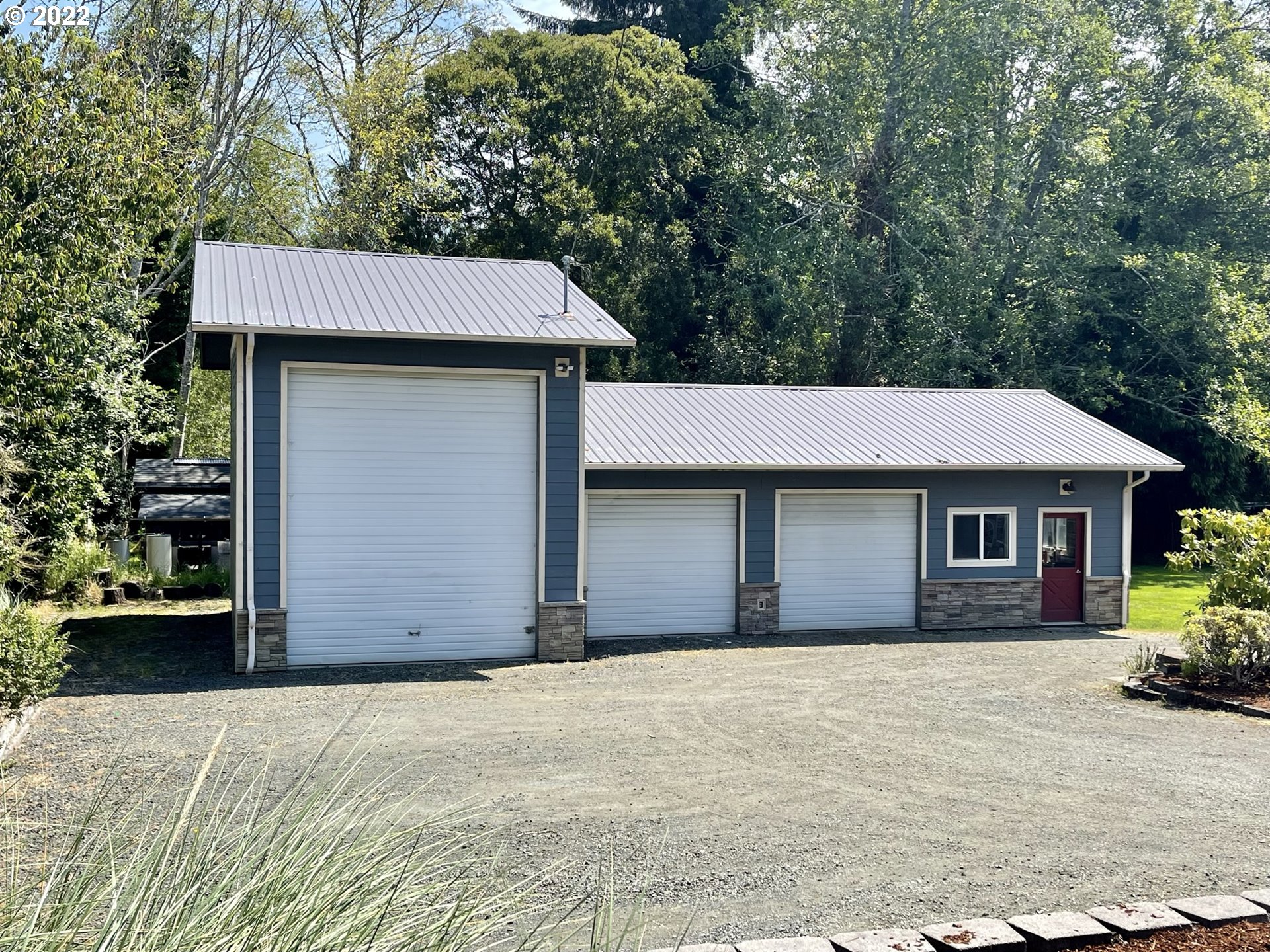 2275 Oak Street North Bend, OR 97459 - Photo 2 of 30 a house with trees in the background