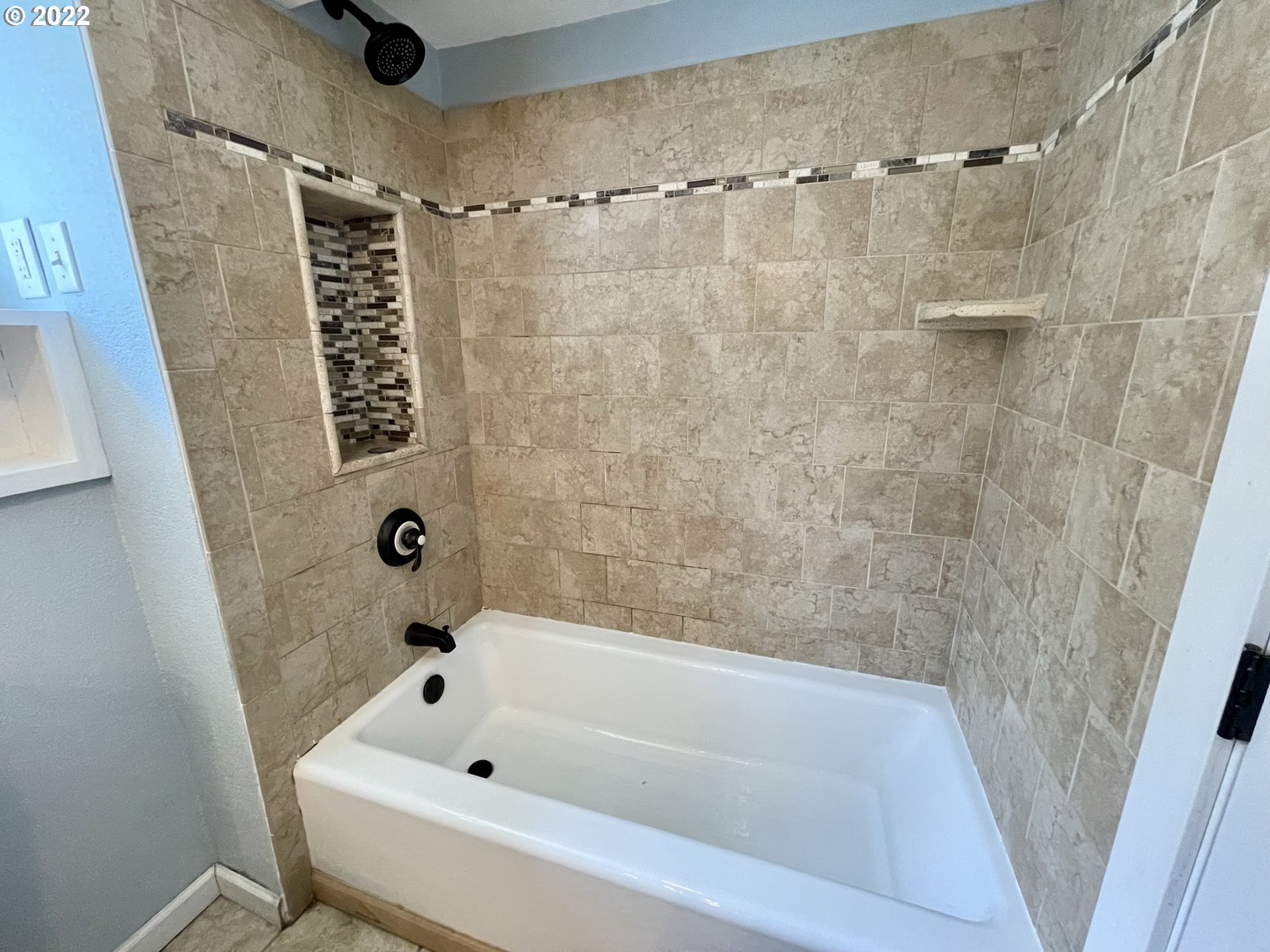 2275 Oak Street North Bend, OR 97459 - Photo 24 of 30 a bathroom with a bathtub and a shower