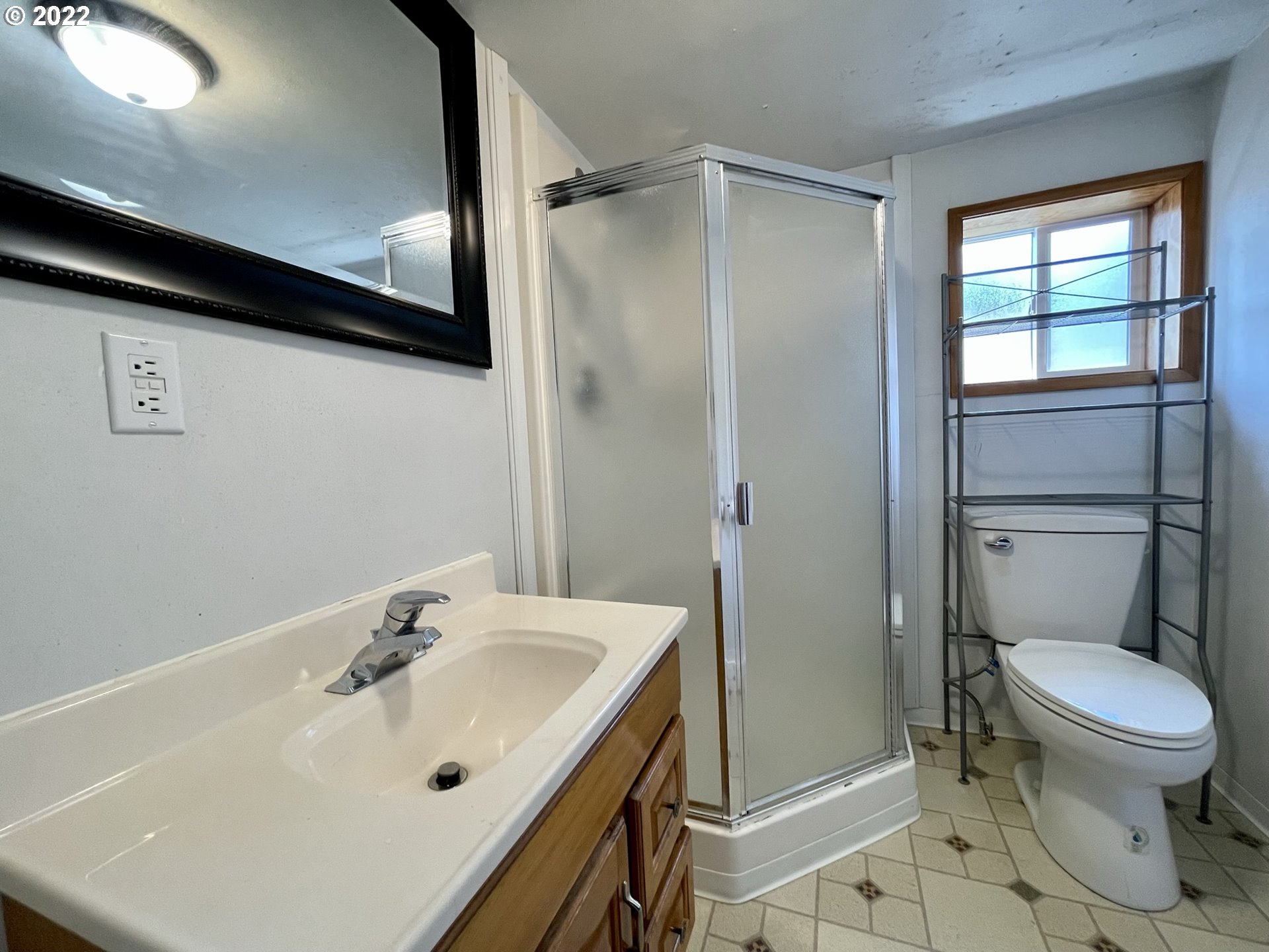2275 Oak Street North Bend, OR 97459 - Photo 27 of 30 a bathroom with a sink toilet and shower