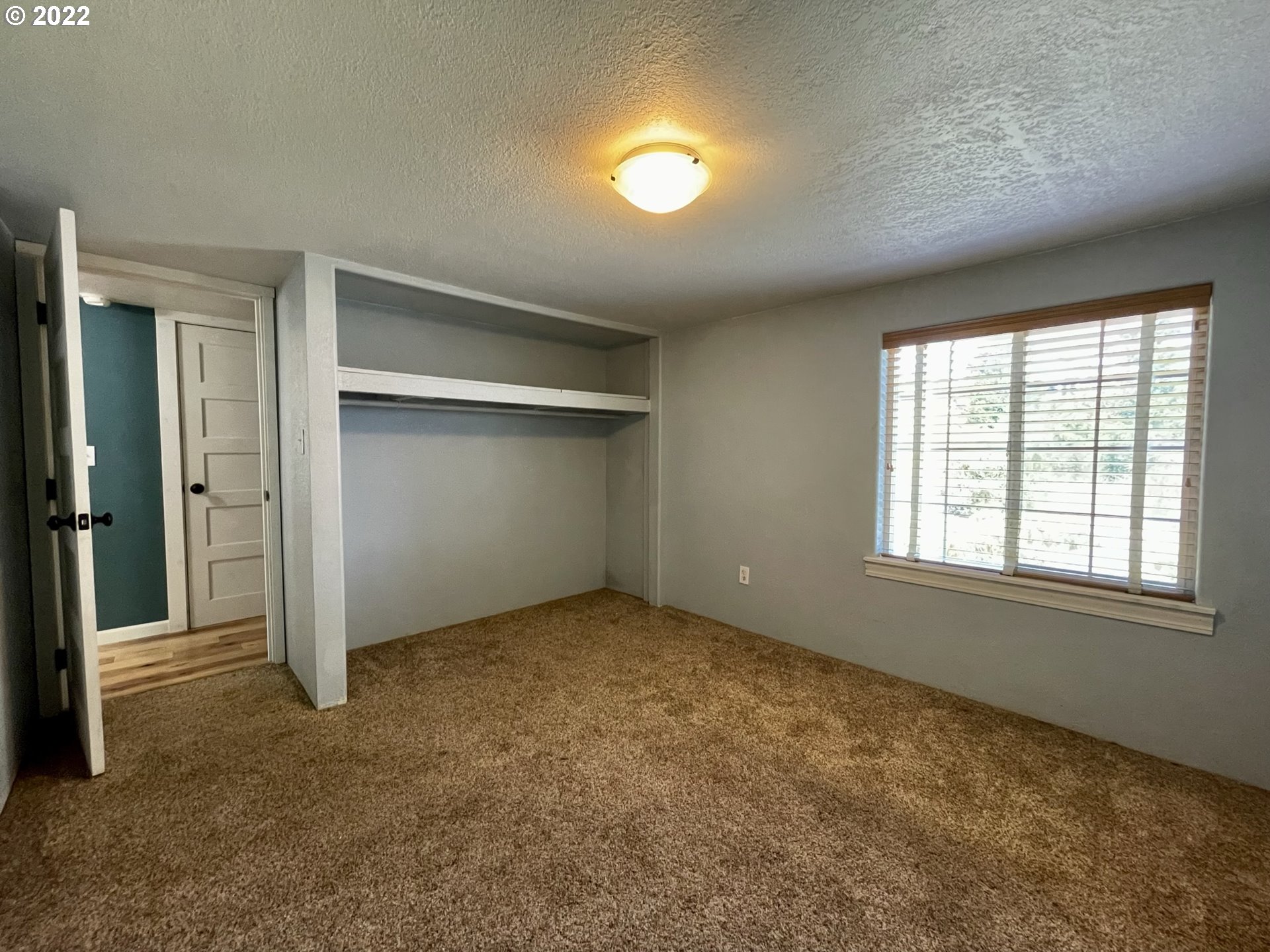 2275 Oak Street North Bend, OR 97459 - Photo 29 of 30 an empty room with windows and closet