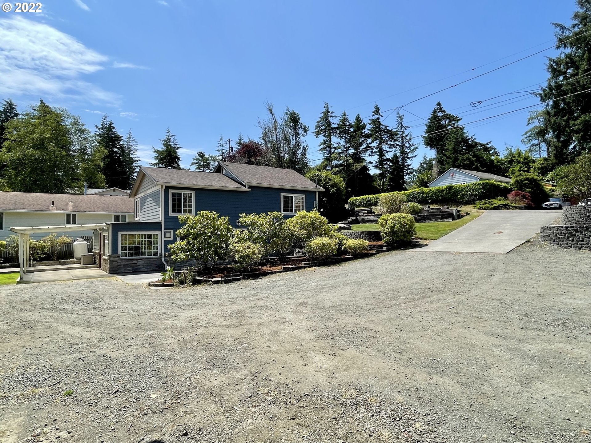 2275 Oak Street North Bend, OR 97459 - Photo 7 of 30 an outdoor view of a house with a yard and street
