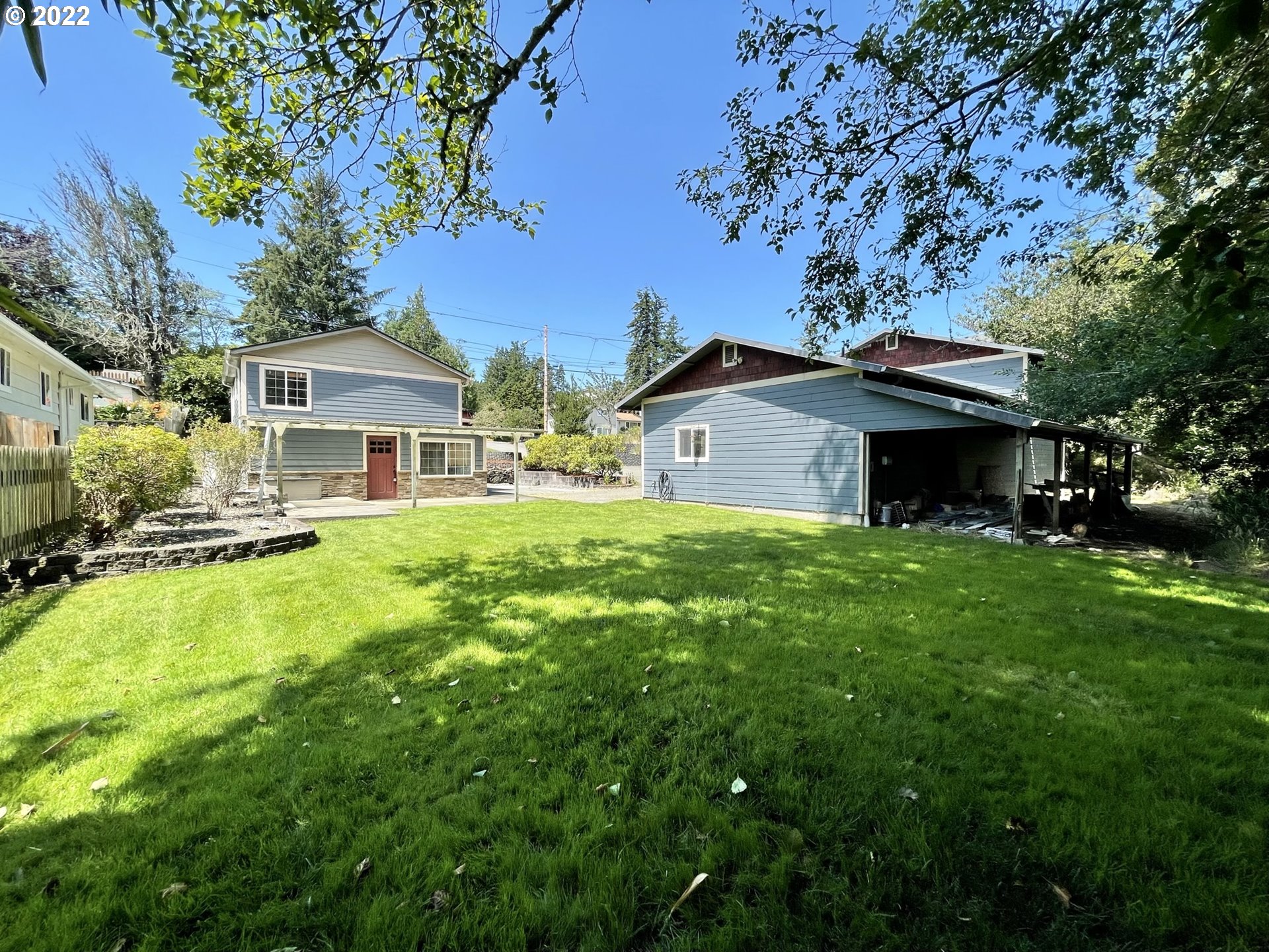 2275 Oak Street North Bend, OR 97459 - Photo 10 of 30 a front view of a house with a yard table and chairs