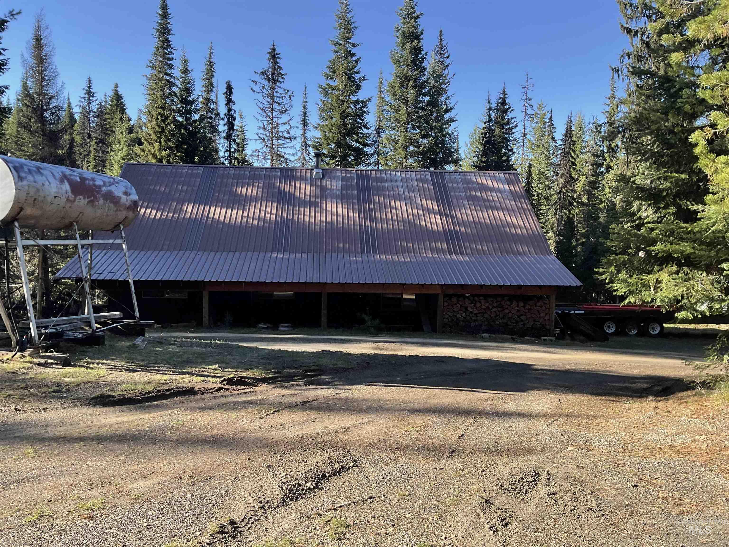 176 West Buffalo Gulch Road Elk City, ID 83525 - Photo 33 of 38 Barn structure featuring a metal roof and exposed wood framing