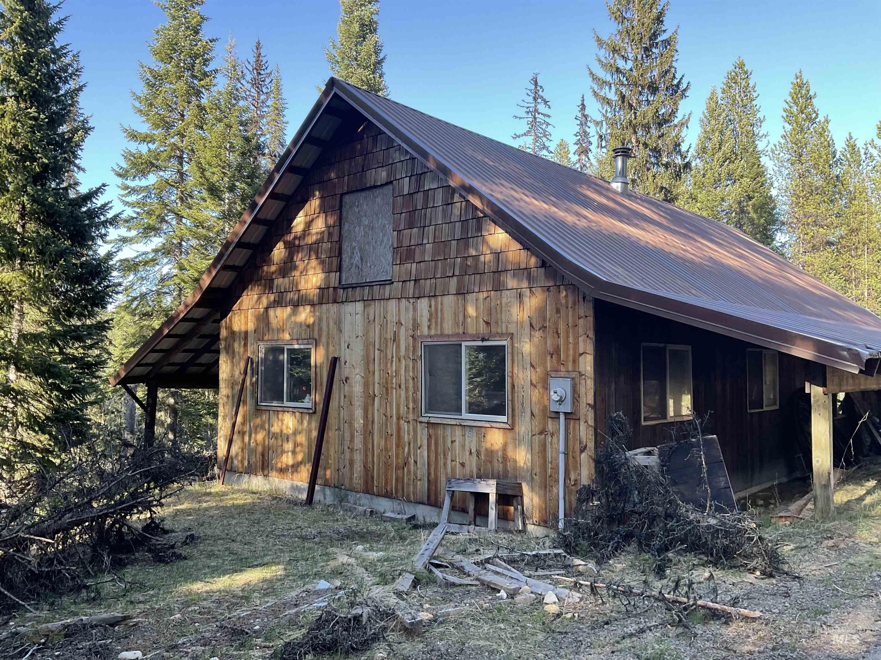 176 West Buffalo Gulch Road Elk City, ID 83525 - Photo 34 of 38 Wood-sided structure with a pitched metal roof