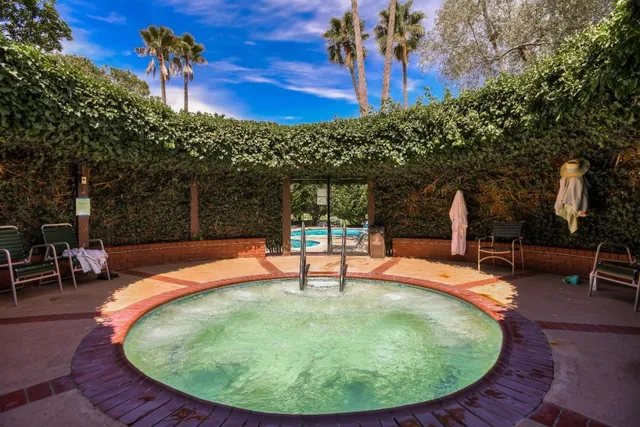 a view of a swimming pool with a patio