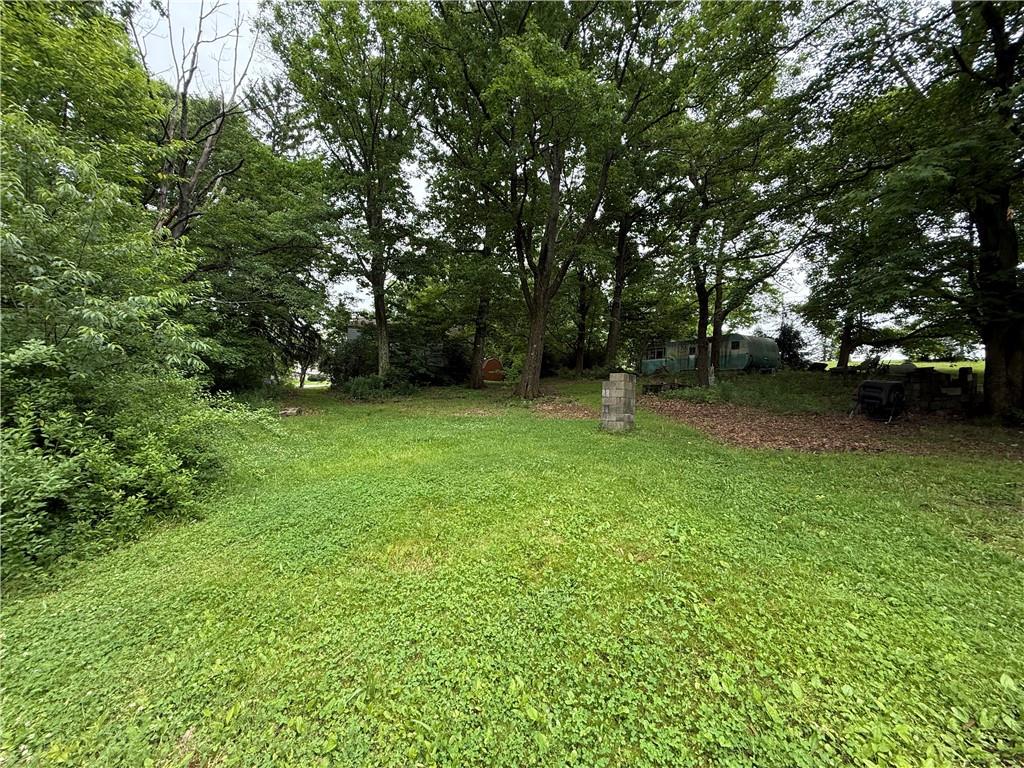 701 Chicora Road Chicora, PA 16025 - Photo 5 of 16 a view of a green field with trees in the background