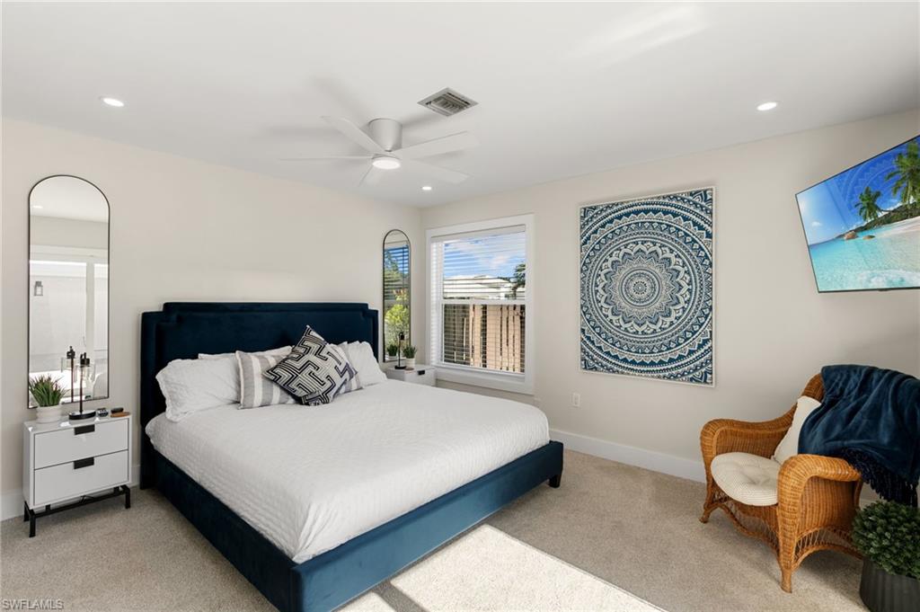 321 Columbus Way Marco Island, FL 34145 - Photo 13 of 40 Bedroom with recessed lighting, light carpet, and a ceiling fan