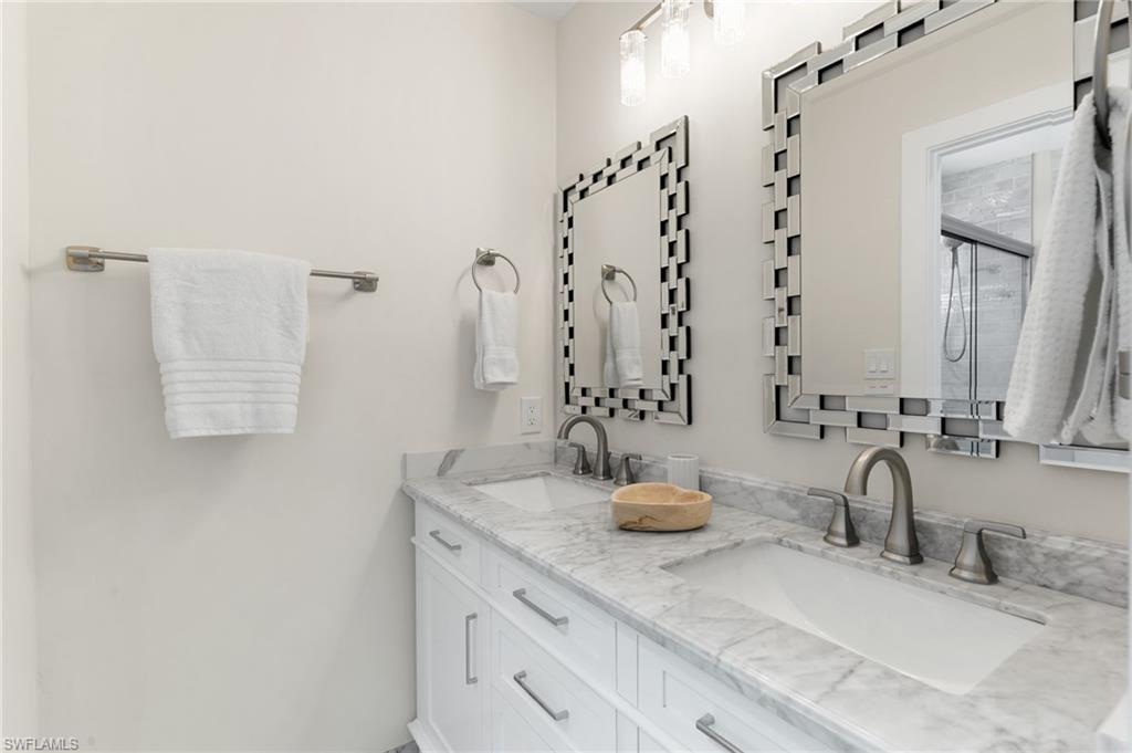 321 Columbus Way Marco Island, FL 34145 - Photo 19 of 40 Full bath featuring double vanity and an enclosed shower