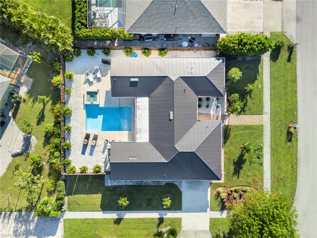 321 Columbus Way Marco Island, FL 34145 - Photo 34 of 40 Aerial view of property and surrounding area with a pool area