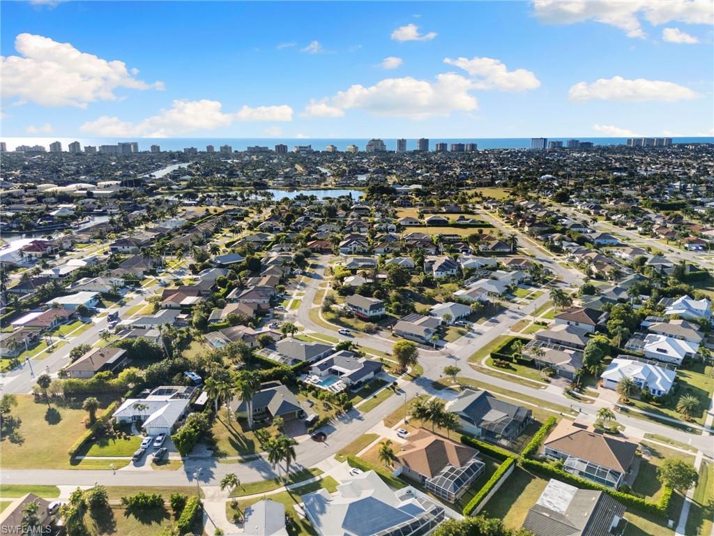 321 Columbus Way Marco Island, FL 34145 - Photo 39 of 40 Aerial view of property and surrounding area with skyline and nearby suburban area